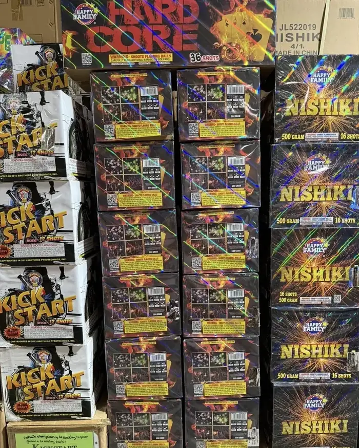 Hard Core, Nishiki, and Kick Start fireworks stacked in the showroom